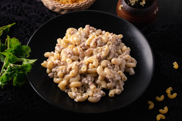 Macaroni Stir-fried with Carbonara Sauce in Black Plates