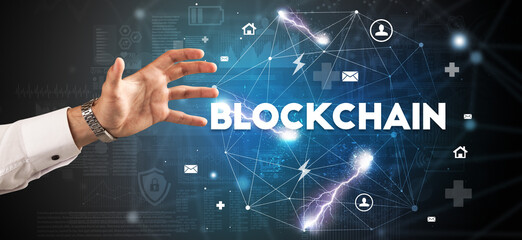 Hand pointing at BLOCKCHAIN inscription, modern technology concept