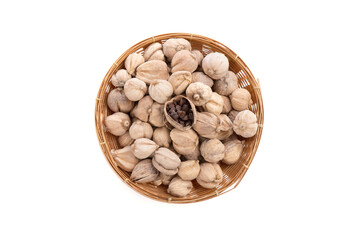 Flat lay, top view dried Siam cardamom in a bamboo basket isolated on white background.