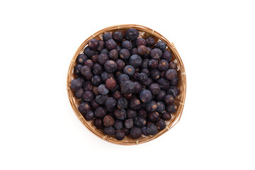 Flat lay, top view dried Juniper Berry in a bamboo basket isolated on white background.