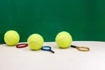 Tennis balls are on green grass