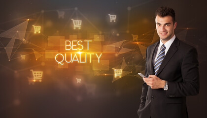 Businessman with shopping cart icons and BEST QUALITY inscription, online shopping concept