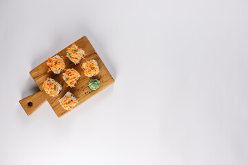 Appetizing rolls on a white background. Japanese food concept. Close-up. Copy space. Flat lay.