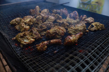 BBQ Honey Chicken, Malaysian food is on the grill with smoke.