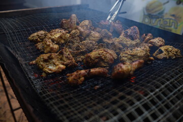 BBQ Honey Chicken, Malaysian food is on the grill with smoke.