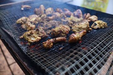 BBQ Honey Chicken, Malaysian food is on the grill with smoke.