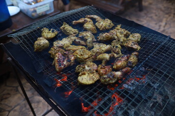 BBQ Honey Chicken, Malaysian food is on the grill with smoke.
