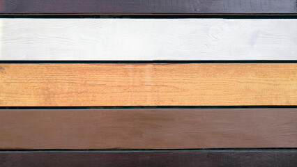 Background from multi-colored painted horizontal boards. Wood texture.