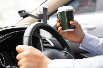 Eat a cup of coffee in the car during your commute to work.