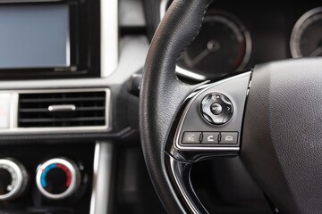 Fototapeta na wymiar Steering wheel with control buttons.