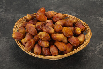 Sweet tasty dry dates in the basket