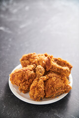 crispy southern style fried chicken in a black stone table