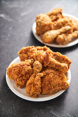 crispy southern style fried chicken in a black stone table