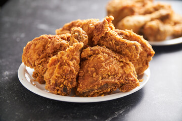 crispy southern style fried chicken in a black stone table