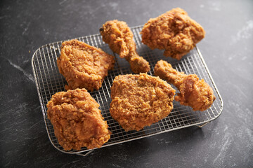 crispy southern style fried chicken in a black stone table