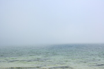 Ravda, Bulgaria. May, 20, 2014. Sea mist. water surface covered with aerozole. Foggy seashore defocused blurry background