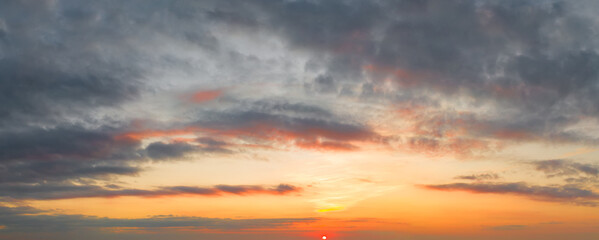 Bright and intense Panorama twilight cloudy sky. Evening background image
