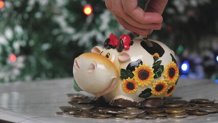Piggy bank cow. Christmas. 2021 new year. Year of the bull. Concept. Saving money as a way of life. Close-u