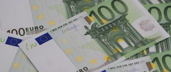 Obraz na płótnie Canvas many 100 euro banknotes on a table