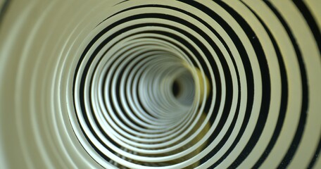 Obraz premium Abstract tunnel shot. Spiral made of paper with soft shadows. Close-up inside spiral paper tape. High quality.