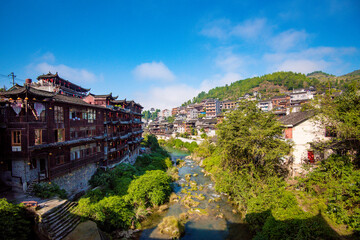  Street view local visitor and tourist in Furong Ancient Town (Furong Zhen, Hibiscus Town), China. Furong Ancient Town is famous tourism attraction place.