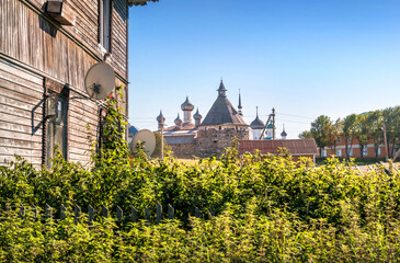 View of the domes of the churches of the Solovetsky Monastery from the wall of a wooden residential building