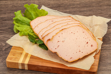 Boiled pork sausage over board