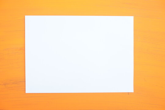 Orange background White kraft paper with free copy space for your text