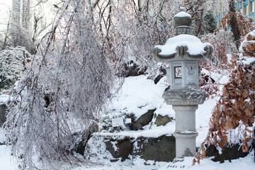 Snow covered Japanese garden lantern