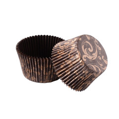 Brown paper baking forms for muffins and cupcakes with golden pattern
