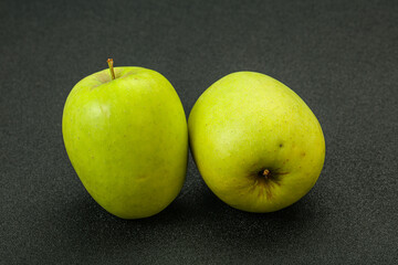 Two ripe green sweet apples