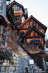 Old wooden houses built on mountain slope in Hallstatt