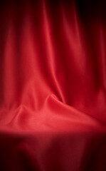 Red cloth waves texture background stage shot in table top for christmas background 