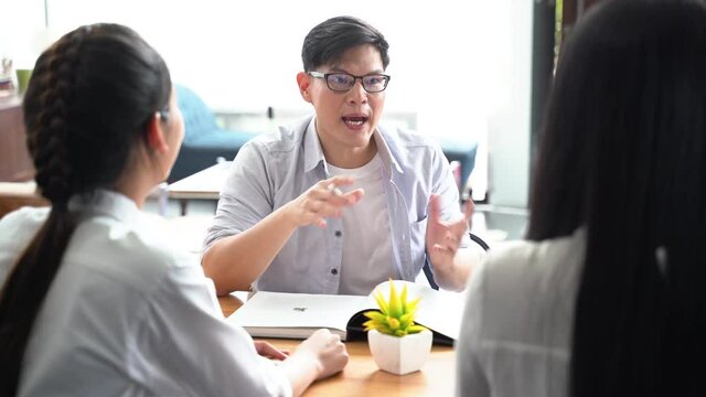 Group of Asian friends working and meeting on a new project at home