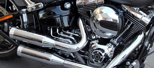 an engine block with exhaust from a motorcycle