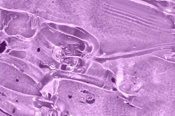 transparent gel texture on purple background luxury beauty treatment toned