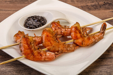 Grilled prawn skewer with pepper sauce