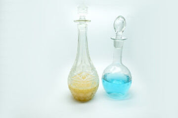 three bottles with bright color fruit lemonade, blue yellow special painted bar drinks