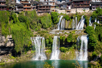  Street view local visitor and tourist in Furong Ancient Town (Furong Zhen, Hibiscus Town), China. Furong Ancient Town is famous tourism attraction place.