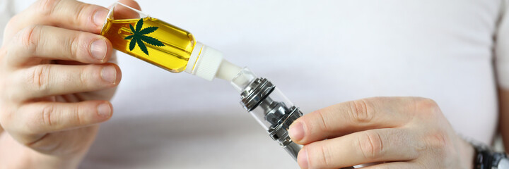 Refill hemp oil from bottle electronic cigarette. Strong effect on human body. Determine quality...