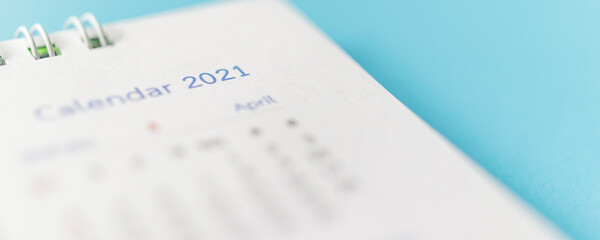 2021 calendar page on blue background business planning appointment meeting concept