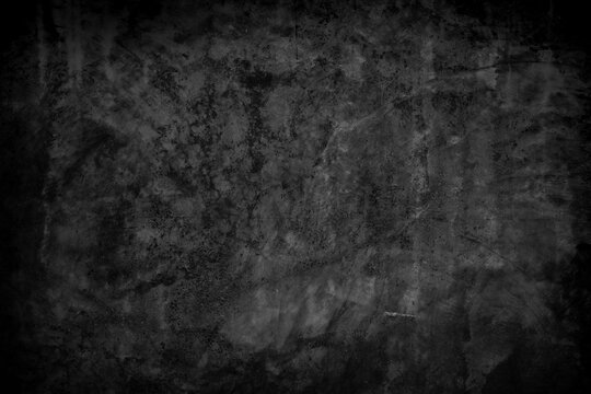Black polished concrete wall texture background. Rough concrete grunge surface.