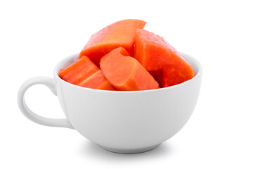 Papaya sliced in a ceramic bowl on white background