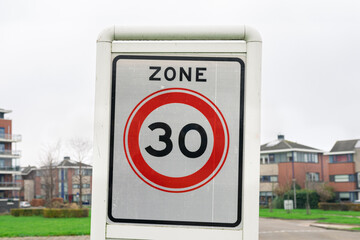 Sign with "Zone 30" indicating the speed limit in the specific area.