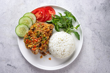 Ayam Geprek is Popular Street Food in Indonesia. Made from Crispy Chicken Smashed in Sambal Bawang...