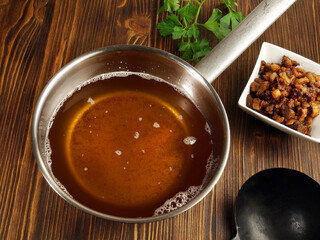 Pork Lard with Greaves - Rendered Pig Fat in a Pot on wooden Background