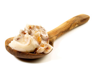 Traditional Pork Lard - Rendered Pig Fat with Greaves on a Spoon isolated on white Background