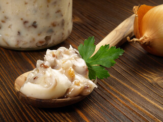 Pork Lard - Rendered Pig Fat on a Spoon on wooden Background