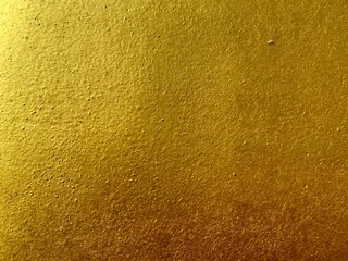 Bright gold color concrete texture 