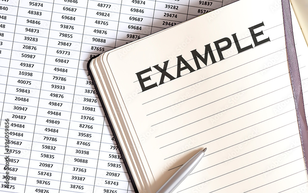 Aufkleber business concept, on the table a notepad with the text of the example on graph